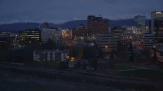 AK0001_0155 - 4K aerial stock footage flying along the shore, by Downtown Anchorage, Alaska, night