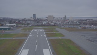 AK0001_0158 - 4K aerial stock footage flying low over Merrill Field approaching Downtown Anchorage, Alaska