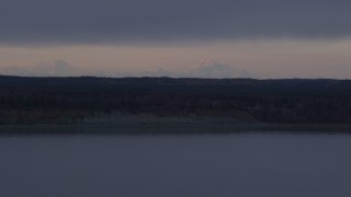 AK0001_0170 - 4K aerial stock footage over shore of Knik Arm of Cook Inlet, approach wide valley, Point MacKenzie, Alaska