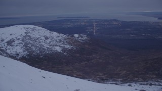 4K aerial stock footage flying by Anchorage, seen from Chugach Mountains, Anchorage, Alaska, twilight Aerial Stock Footage | AK0001_0187