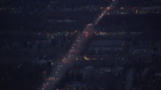 4K aerial stock footage flying over Debarr Road, revealing Merrill Field, Anchorage, Alaska, night Aerial Stock Footage | AK0001_0193