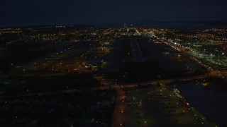 4K aerial stock footage approaching Merrill Field, landing aircraft, Anchorage, Alaska, night Aerial Stock Footage | AK0001_0197