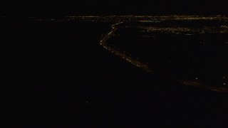 4K aerial stock footage following Glenn Highway, winding toward Anchorage, Alaska, night Aerial Stock Footage | AK0001_0204