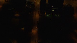 4K aerial stock footage of a bird's eye view of city streets in Downtown Anchorage, Alaska, night Aerial Stock Footage | AK0001_0210