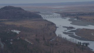 4K aerial stock footage flying by Glenn Highway Bridge, spanning the Knik River, Alaska Aerial Stock Footage | AK0001_0222