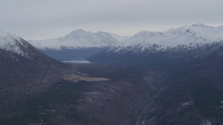 4K aerial stock footage flying by Eklutna Lake, bordered by the Chugach Mountains, Alaska Aerial Stock Footage | AK0001_0227