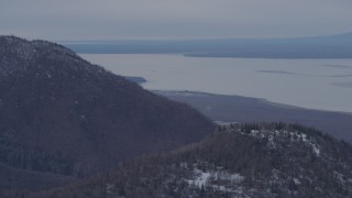 4K aerial stock footage flying by Birchwood, seen from Chugach Mountains, Birchwood, Alaska Aerial Stock Footage | AK0001_0228