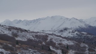 4K aerial stock footage flying by snow capped ridge, Chugach Mountains, Alaska Aerial Stock Footage | AK0001_0236