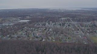 4K aerial stock footage flying over mobile home park, approaching Downtown Anchorage, Alaska Aerial Stock Footage | AK0001_0242