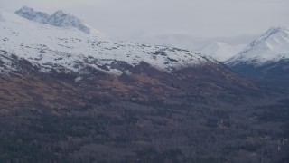 4K aerial stock footage flying over forested valley, approaching Chugach Mountains, Alaska Aerial Stock Footage | AK0001_0254