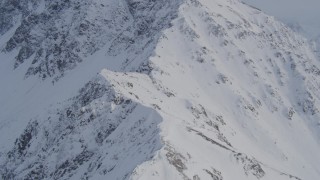 4K aerial stock footage ascending snow covered slope, Chugach Mountains, Alaska Aerial Stock Footage | AK0001_0259