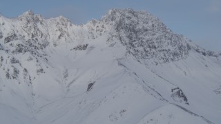 4K aerial stock footage flying by snowy mountain peaks, Chugach Mountains, Alaska Aerial Stock Footage | AK0001_0262