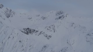 4K aerial stock footage approaching snow covered mountain peaks, Chugach Mountains, Alaska Aerial Stock Footage | AK0001_0263