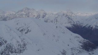 4K aerial stock footage approaching snow covered peaks, deep valley, Chugach Mountains, Alaska Aerial Stock Footage | AK0001_0265