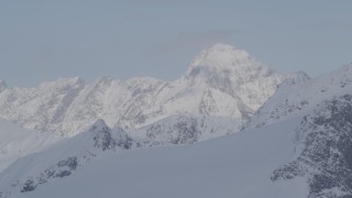 4K aerial stock footage flying by snow covered peaks, Chugach Mountains, Alaska Aerial Stock Footage | AK0001_0271