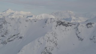 4K aerial stock footage approach snowy range, revealing a distant valley, Chugach Mountains, Alaska Aerial Stock Footage | AK0001_0277