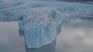 AK0001_0282 - 4K aerial stock footage approaching glacier, flying along the edge, Inner Lake George, Alaska