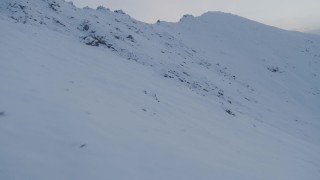 4K aerial stock footage flying over snowy slopes, Chugach Mountains, Alaska, twilight Aerial Stock Footage | AK0001_0328