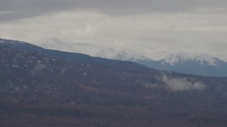 4K aerial stock footage flying by rural homes on a mountain slope, Chugach Mountains, Anchorage, Alaska Aerial Stock Footage | AK0001_0339