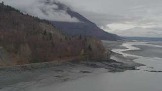 4K aerial stock footage train tracks, Chugach Mountains, from Turnagain Arm of the Cook Inlet, Alaska Aerial Stock Footage | AK0001_0356