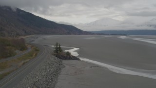 AK0001_0360 - 4K aerial stock footage railroad tracks along foothills bordering Turnagain Arm of the Cook Inlet, Alaska