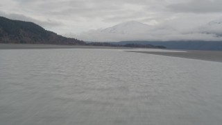 4K aerial stock footage flying low over the shore, out over water, Turnagain Arm of the Cook Inlet, Alaska Aerial Stock Footage | AK0001_0362