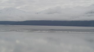 4K aerial stock footage flying by cloud covered Kenai Mountains, Turnagain Arm of the Cook Inlet, Alaska Aerial Stock Footage | AK0001_0367