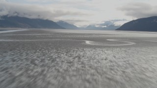 4K aerial stock footage flying low over water, tilt up, revealing Turnagain Arm of the Cook Inlet, Alaska Aerial Stock Footage | AK0001_0372