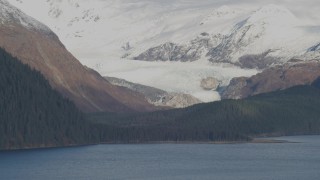 4K aerial stock footage fly by glacier near shore, snowy Chugach Mountain peaks, Passage Canal, Alaska Aerial Stock Footage | AK0001_0398