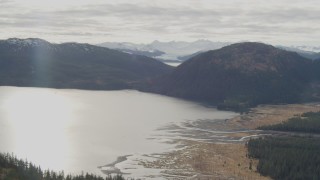 4K aerial stock footage flying by river emptying into bay, Prince William Sound, Alaska Aerial Stock Footage | AK0001_0424