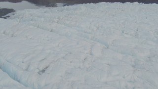 4K aerial stock footage fly low over glacier, tilt to closeup of surface, Prince William Sound, Alaska Aerial Stock Footage | AK0001_0441