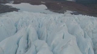 4K aerial stock footage tilt up from glacier to reveal bay, tree lined shore, Prince William Sound, Alaska Aerial Stock Footage | AK0001_0452