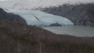 4K aerial stock footage ascending grassy ridge, approach Portage Lake, base of Portage Glacier, Alaska Aerial Stock Footage | AK0001_0504