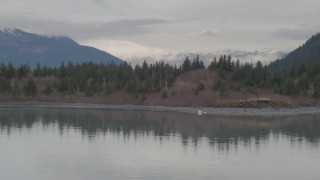 AK0001_0508 - 4K aerial stock footage fly over Portage Lake, approach shoreline, reveal river valley, Portage Lake, Alaska