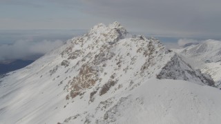 4K aerial stock footage flying along a snowy covered ridge, Chugach Mountains, Alaska Aerial Stock Footage | AK0001_0564