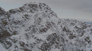 4K aerial stock footage ascend rocky slopes, reveal low clouds, Anchorage, Chugach Mountains, Alaska Aerial Stock Footage | AK0001_0575