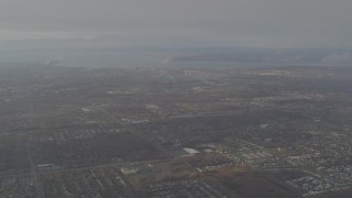 AK0001_0579 - 4K aerial stock footage descending through low clouds, revealing Downtown Anchorage, Alaska