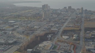 4K aerial stock footage flying by East 5th Avenue, tilt up, revealing Downtown Anchorage, Alaska Aerial Stock Footage | AK0001_0583