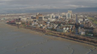 4K aerial stock footage flying over the shore, approaching Downtown Anchorage, Alaska Aerial Stock Footage | AK0001_0590