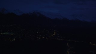 4K aerial stock footage fly by neighborhood lights, base of Chugach Mountains, Anchorage, Alaska, night Aerial Stock Footage | AK0001_0605