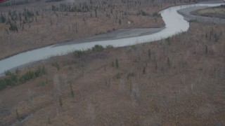 4K aerial stock footage flying away from the river, over trees, water, Knik River, Alaska Aerial Stock Footage | AK0001_0619