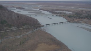 4K aerial stock footage the Glenn Highway Bridge, train bridge, spanning the Knik River, Alaska Aerial Stock Footage | AK0001_0621