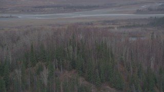 4K aerial stock footage flying by wooded hill, river valley in background, Knik River, Alaska Aerial Stock Footage | AK0001_0622