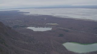 AK0001_0646 - 4K aerial stock footage fly over Chugach Mountains, reveal Knik Arm of the Cook Inlet, Birchwood, Alaska