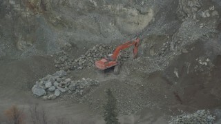 4K aerial stock footage orbiting an excavator working on a hillside, Chugiak, Alaska Aerial Stock Footage | AK0001_0656