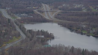 4K aerial stock footage approaching Lower Fire Lake, homes, Old Glenn Highway, Chugiak, Alaska Aerial Stock Footage | AK0001_0661