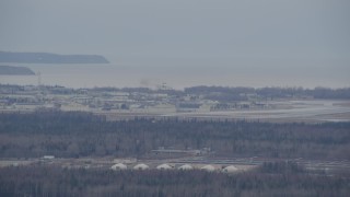 4K aerial stock footage tracking military jet approaching Elmendorf Air Force Base, Anchorage, Alaska Aerial Stock Footage | AK0001_0666