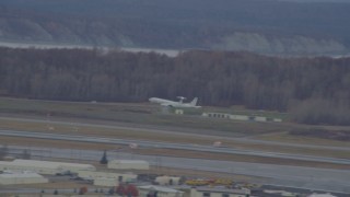 4K aerial stock footage tracking E-3 Sentry taking off, Elmendorf Air Force Base, Alaska Aerial Stock Footage | AK0001_0673