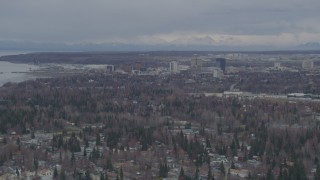 4K aerial stock footage flying near Westchester Lagoon, approaching Downtown Anchorage, Alaska Aerial Stock Footage | AK0001_0688