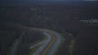 4K aerial stock footage flying over Glenn Highway in winter, Chugiak, Alaska Aerial Stock Footage | AK0001_0709